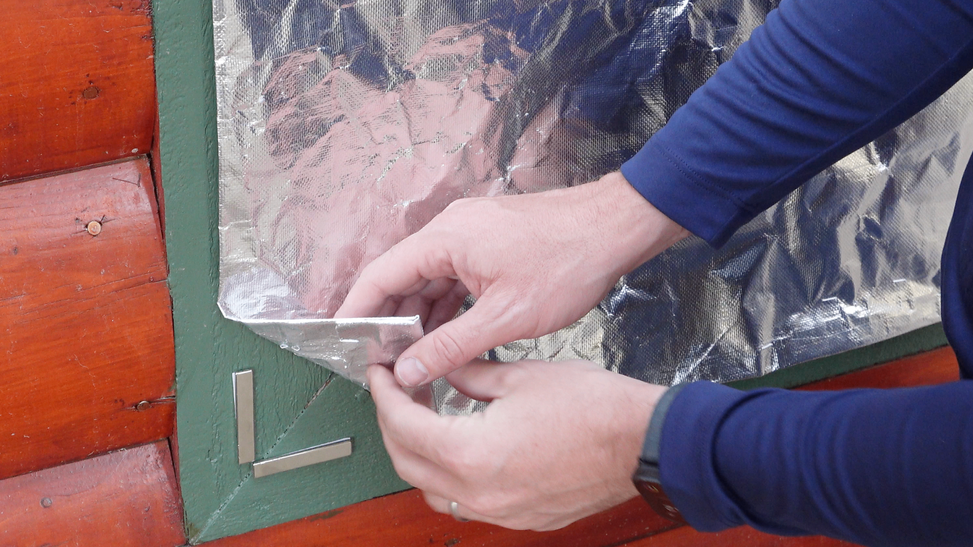 Close-up view of FireFoil cover installation techniques