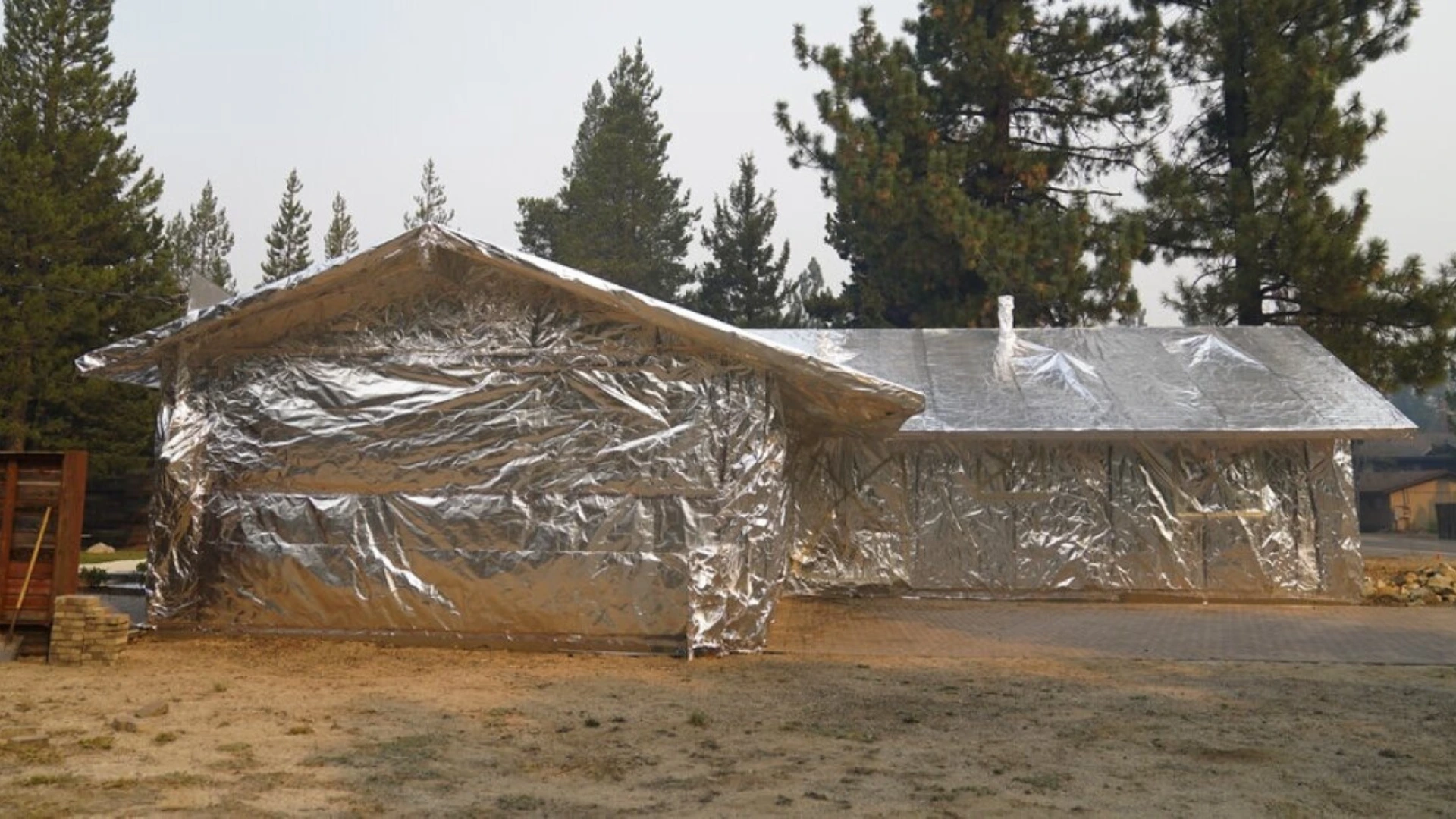 Complete FireFoil house wrap installation in rural setting