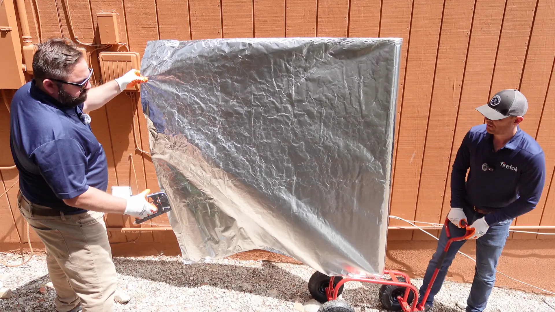 FireFoil team deploying protective shields on residential structure